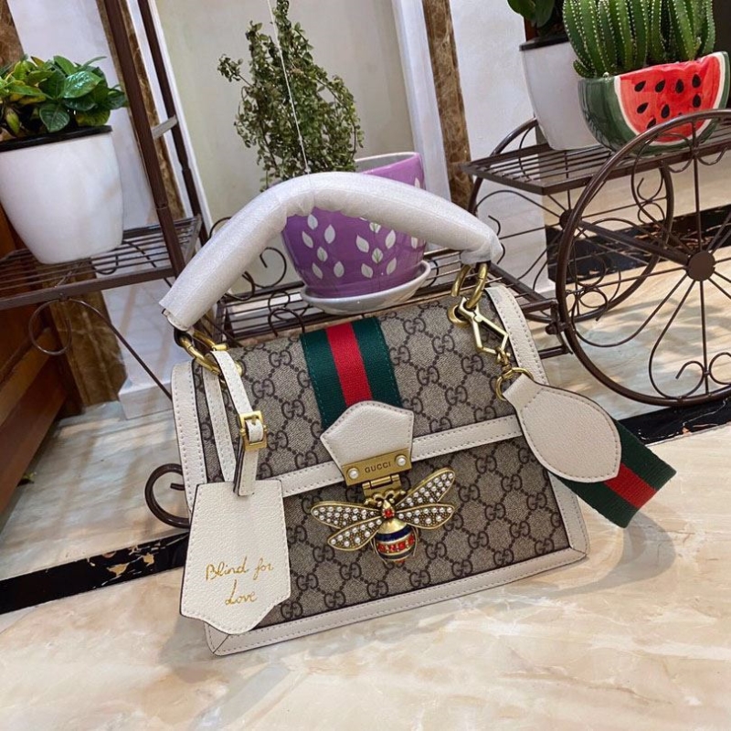 G*u*i top handle bags
